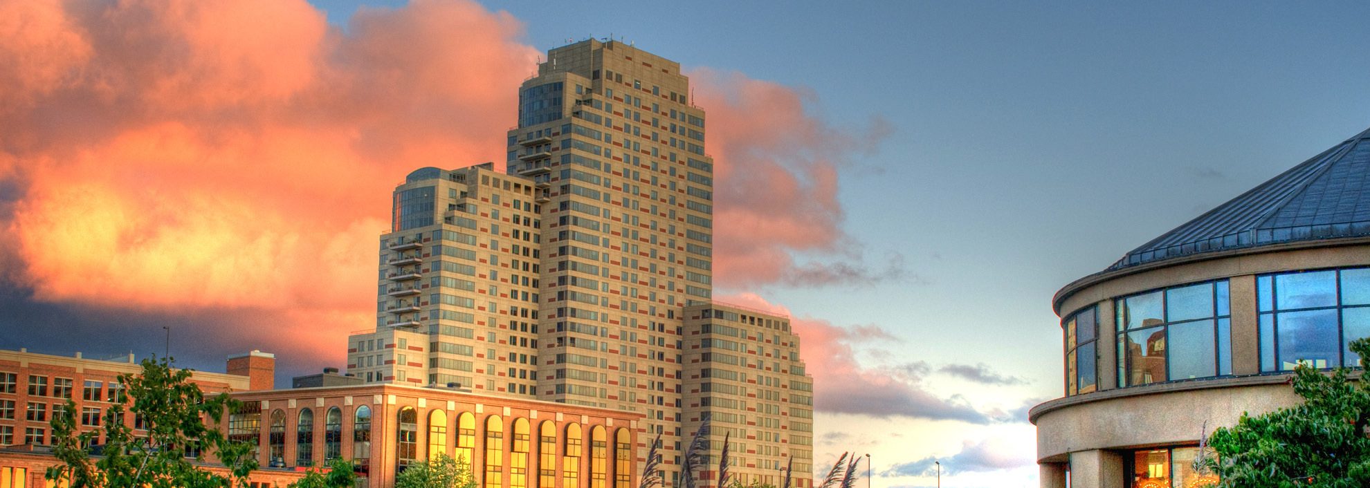 Image of clouds behind buildings on the Grand River in Grand Rapids, Michigan
